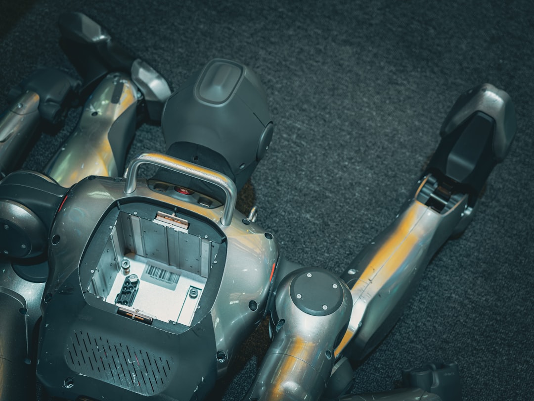 A robotic torso with exposed internal components and arms.